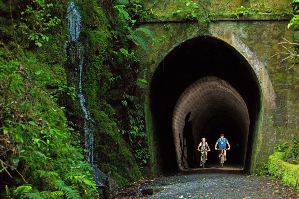 Remutaka Cycle Trail tunnel Two cyclists in Summit Tunnel with headlamps credit Caleb Smith